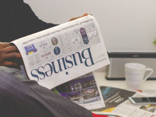 close-up of African-American man reading newspaper