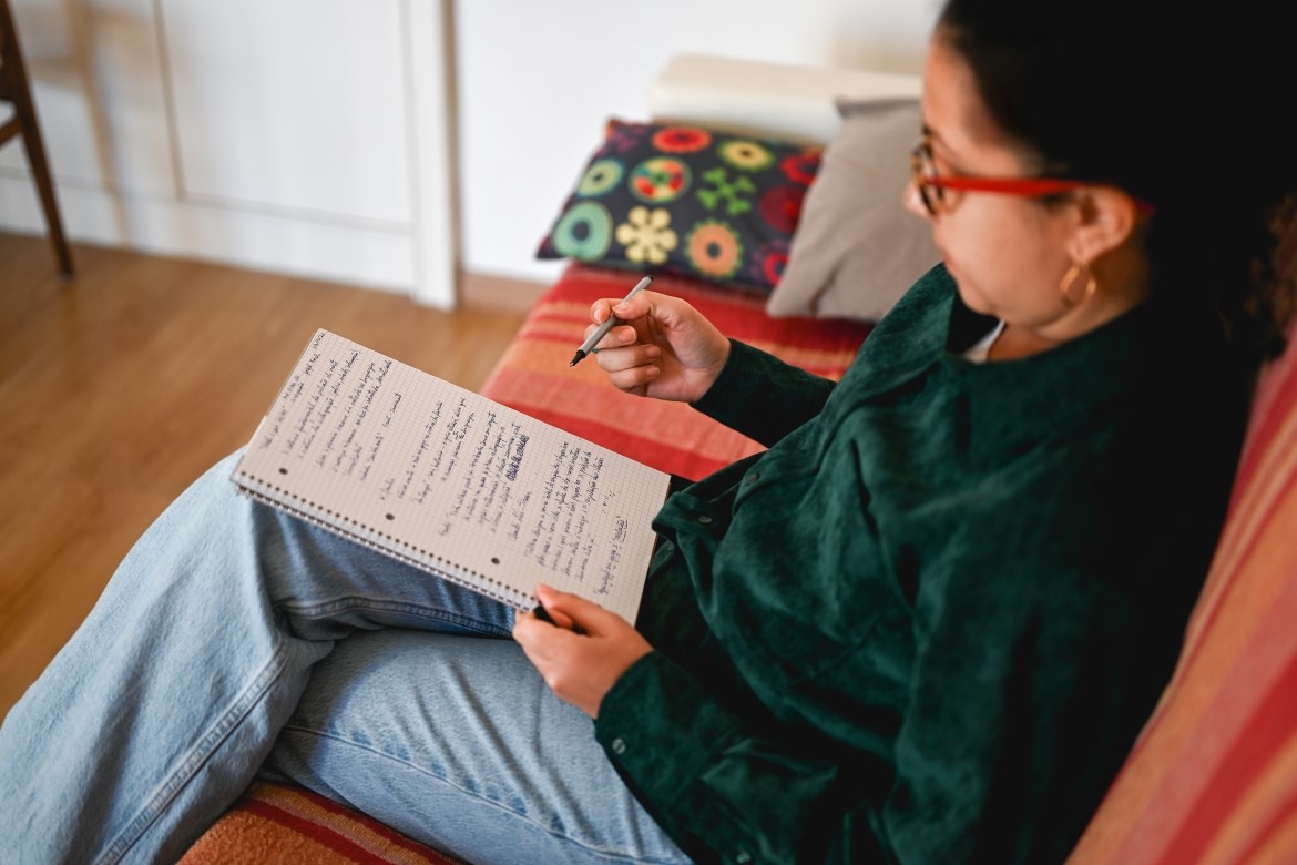 A woman writing notes A woman writing notes