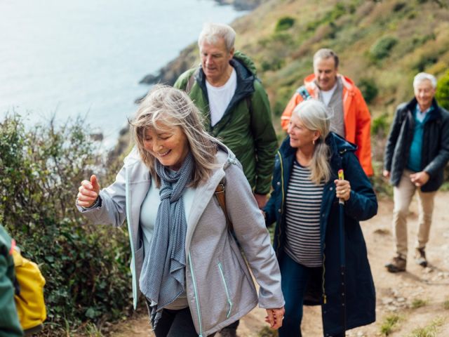 People Hiking Down a Trail