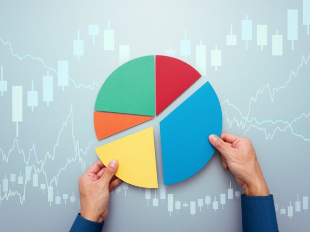 A man holding a pie chart