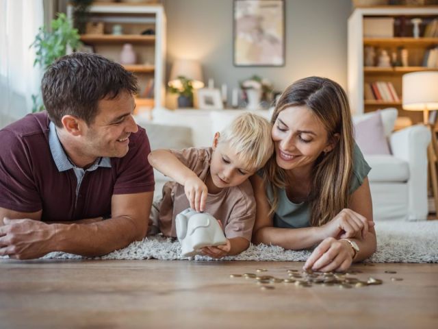 Parents teaching child about money